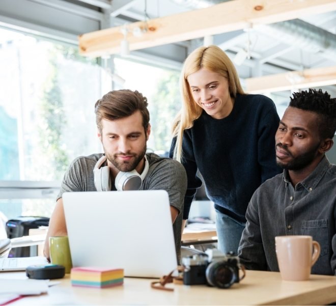 demo-attachment-683-happy-colleagues-sitting-in-office-coworking-PHYA6TG-1